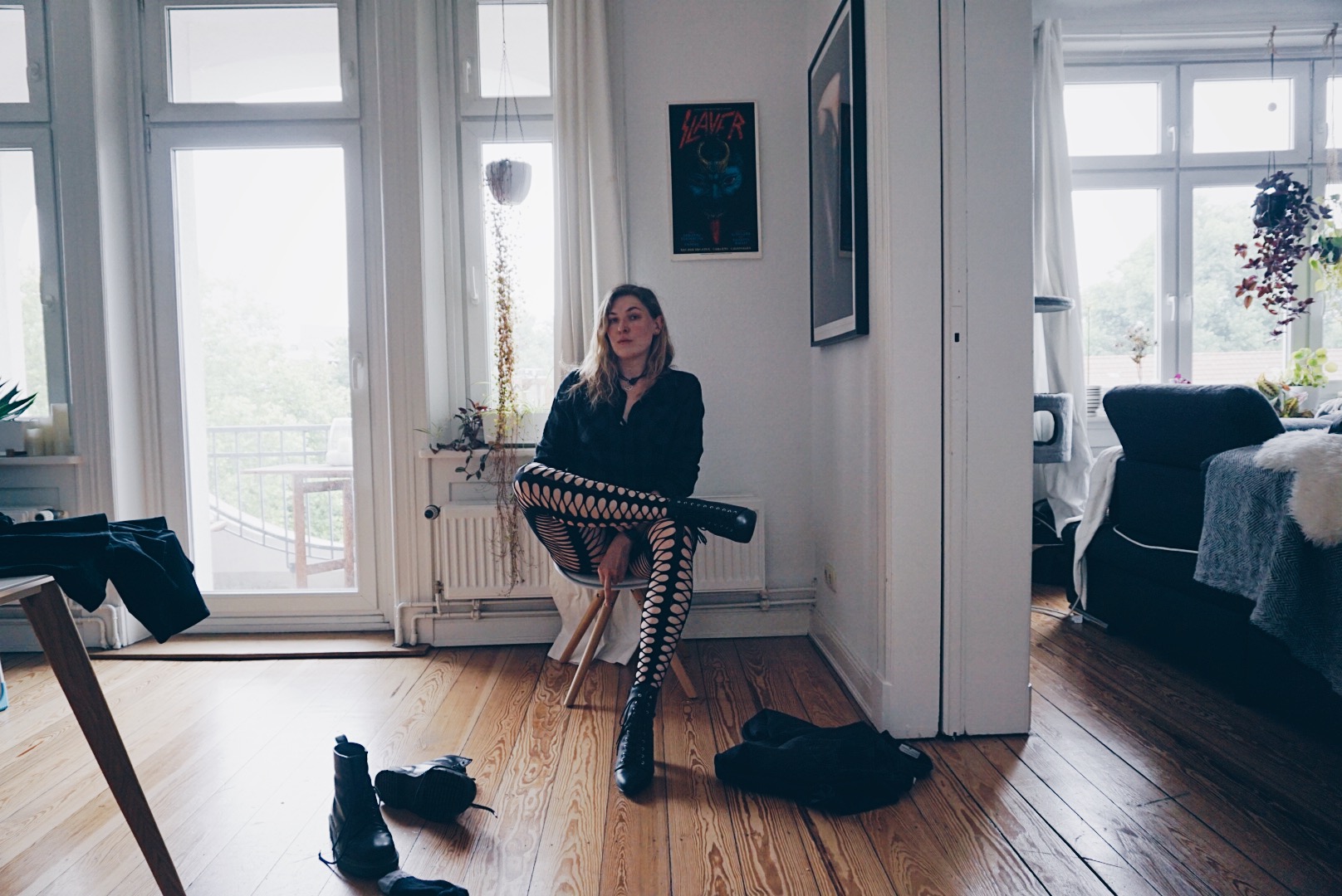 young women sitting ona chair in male clothes