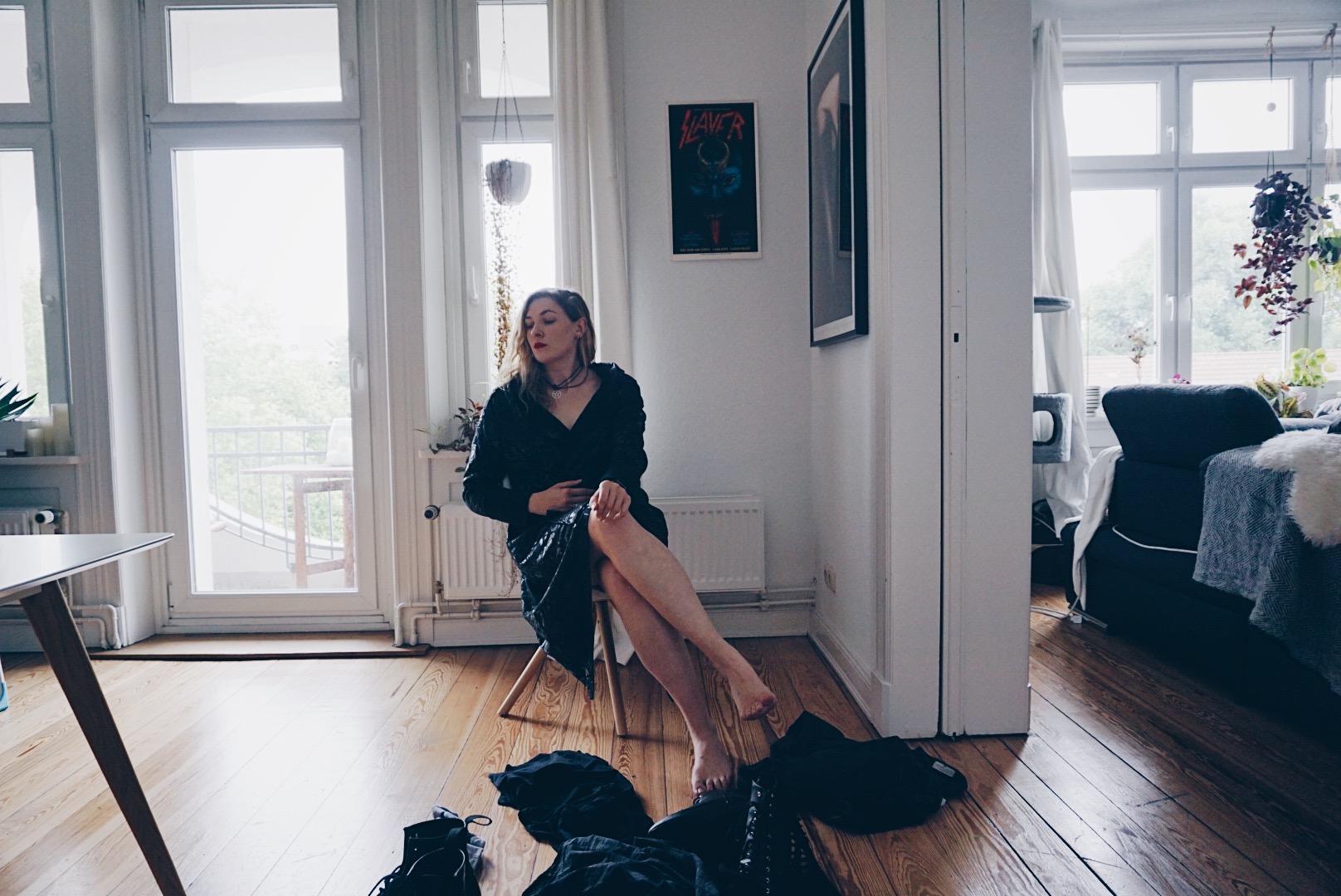 young women sitting ona chair in male clothes